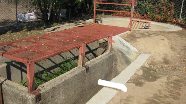 a view of a chairs and table in backyard
