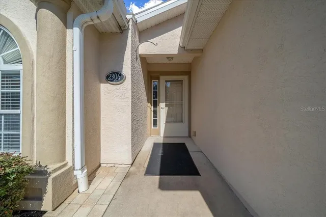 a view of a hallway with front door