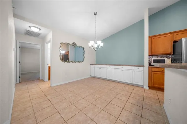 a kitchen with stainless steel appliances granite countertop a stove and a microwave