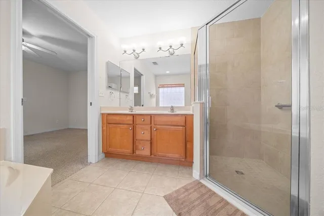 a green field with lots of trees