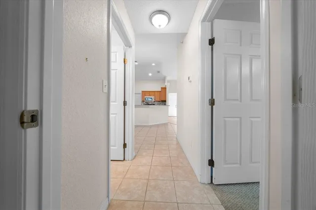 an aerial view of residential houses with outdoor space and street view