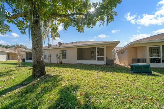 a view of park with large trees