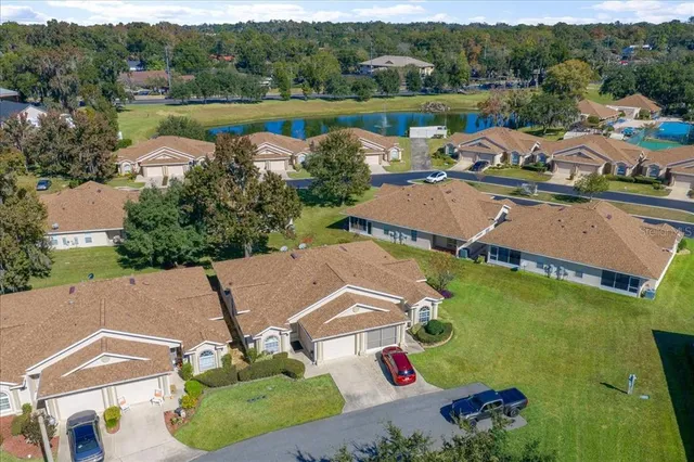 an aerial view of residential house with outdoor space and swimming pool