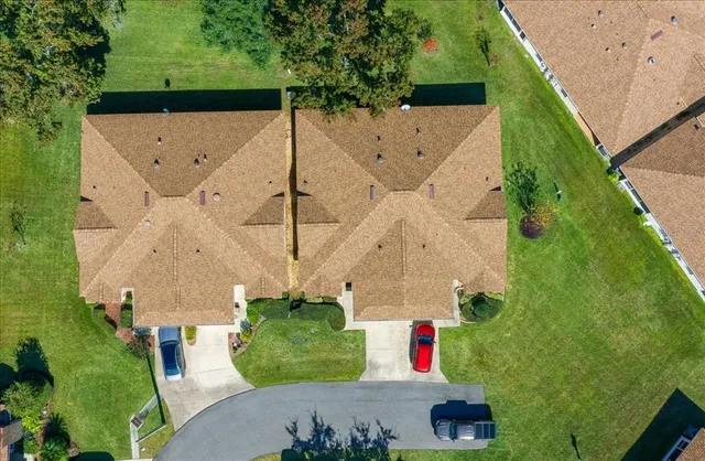 an aerial view of residential house with outdoor space and parking