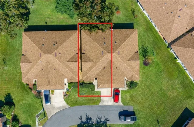 an aerial view of a house with a lake view