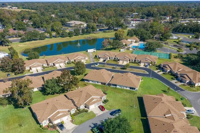 a front view of a house with a garden and yard