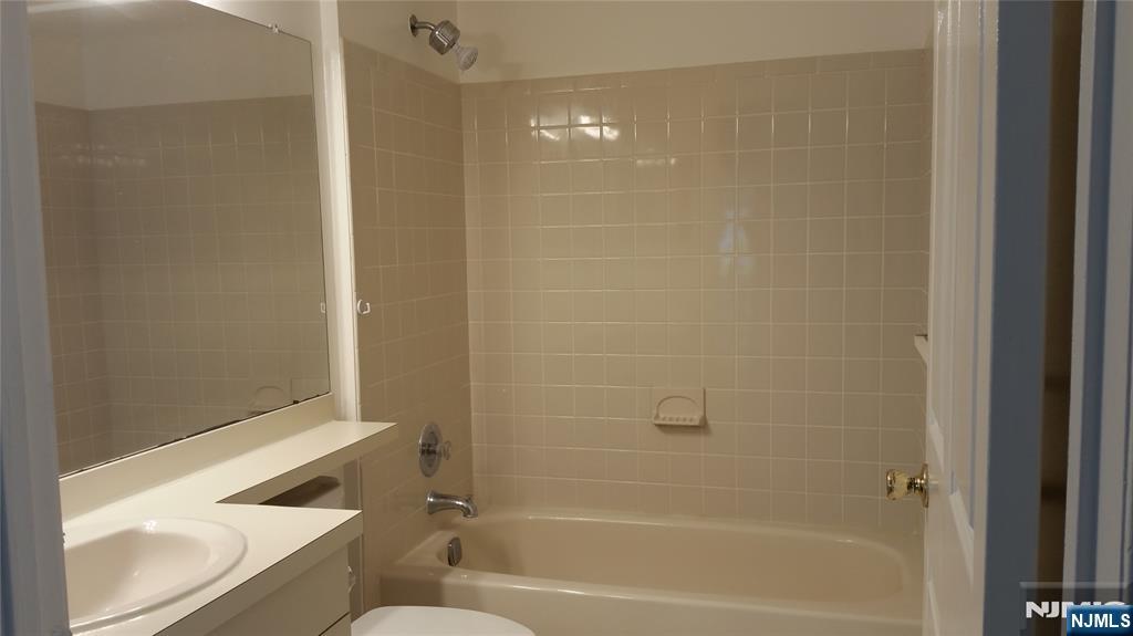 1138 Sycamore Lane Mahwah, NJ 07430 - Photo 5 of 12 a bathroom with a bathtub and a shower