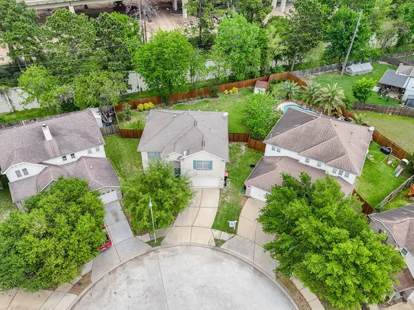 an aerial view of a house with a garden and patio