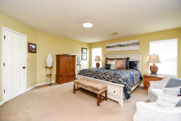 a bedroom with a bed and window