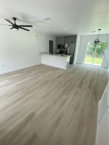 a view of a kitchen with a sink