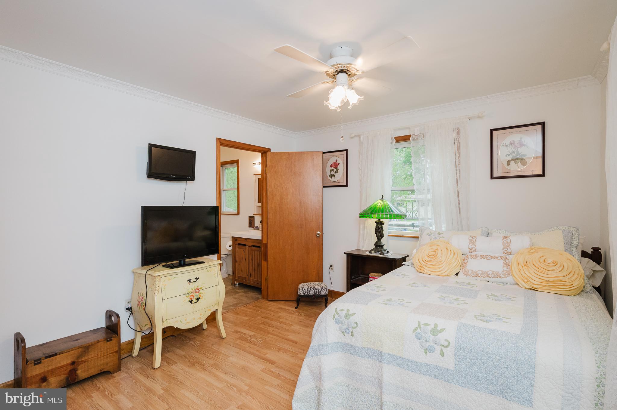 710 Magnolia Road Joppa, MD 21085 - Photo 17 of 58 a bedroom with a bed and a flat screen tv