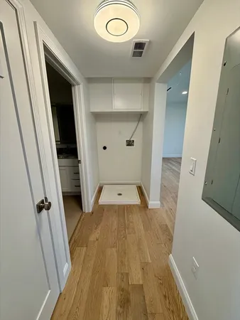 a view of a kitchen from a hallway