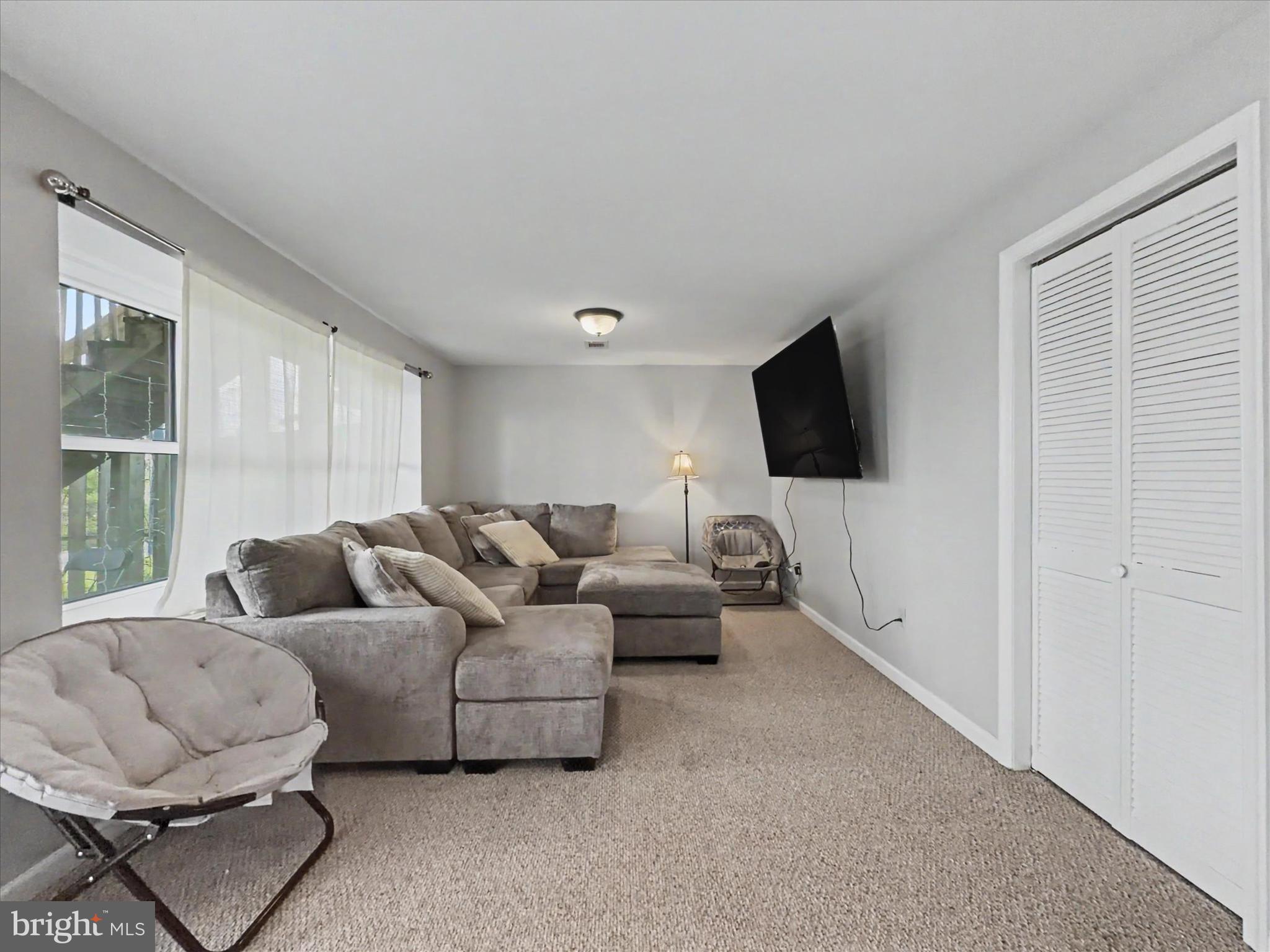 2941 Robin Road York, PA 17404 - Photo 19 of 23 a living room with furniture and a flat screen tv