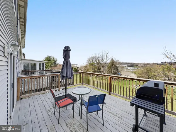 a view of a chairs in wooden deck
