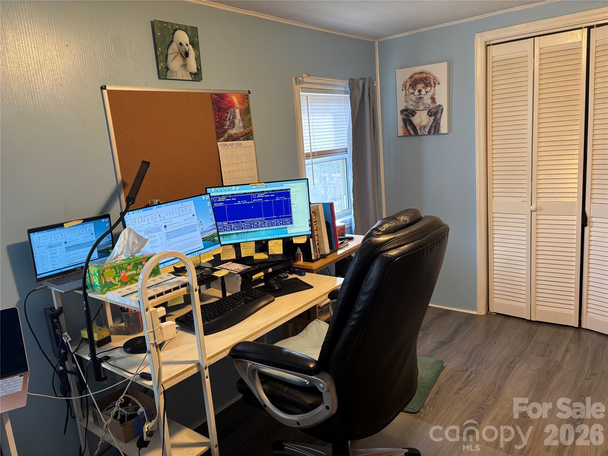 190 Benfield Road Crossnore, NC 28657 - Photo 13 of 36 a view of a workspace with furniture and wooden floor