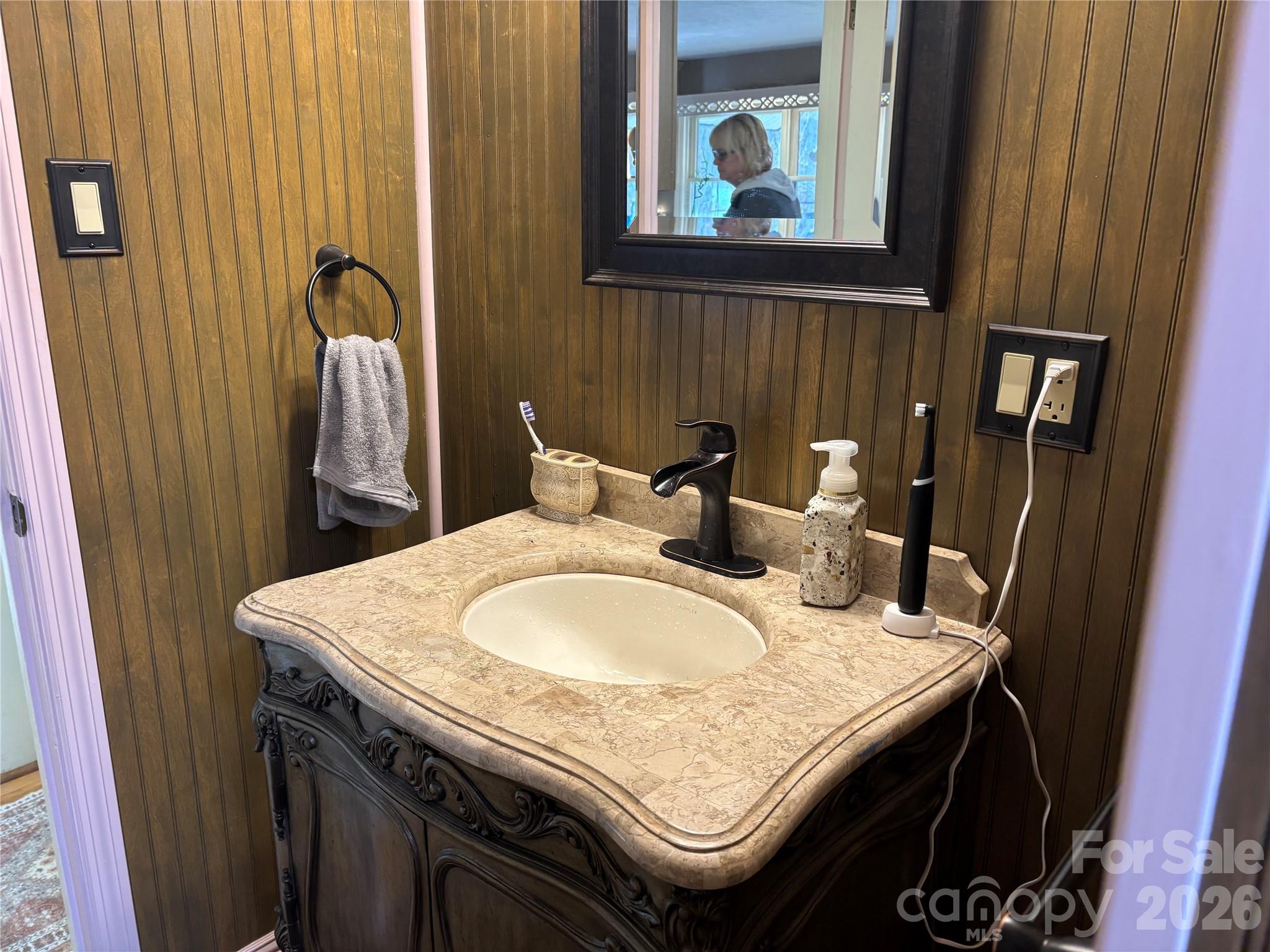 190 Benfield Road Crossnore, NC 28657 - Photo 14 of 36 a bathroom with a granite countertop sink and a mirror