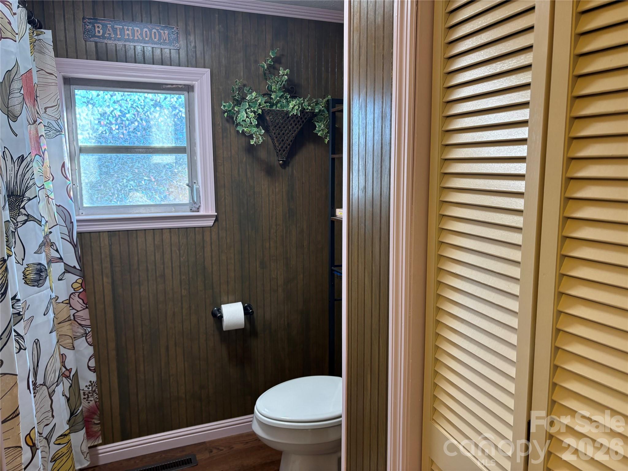190 Benfield Road Crossnore, NC 28657 - Photo 15 of 36 a bathroom with a toilet and a shower curtain