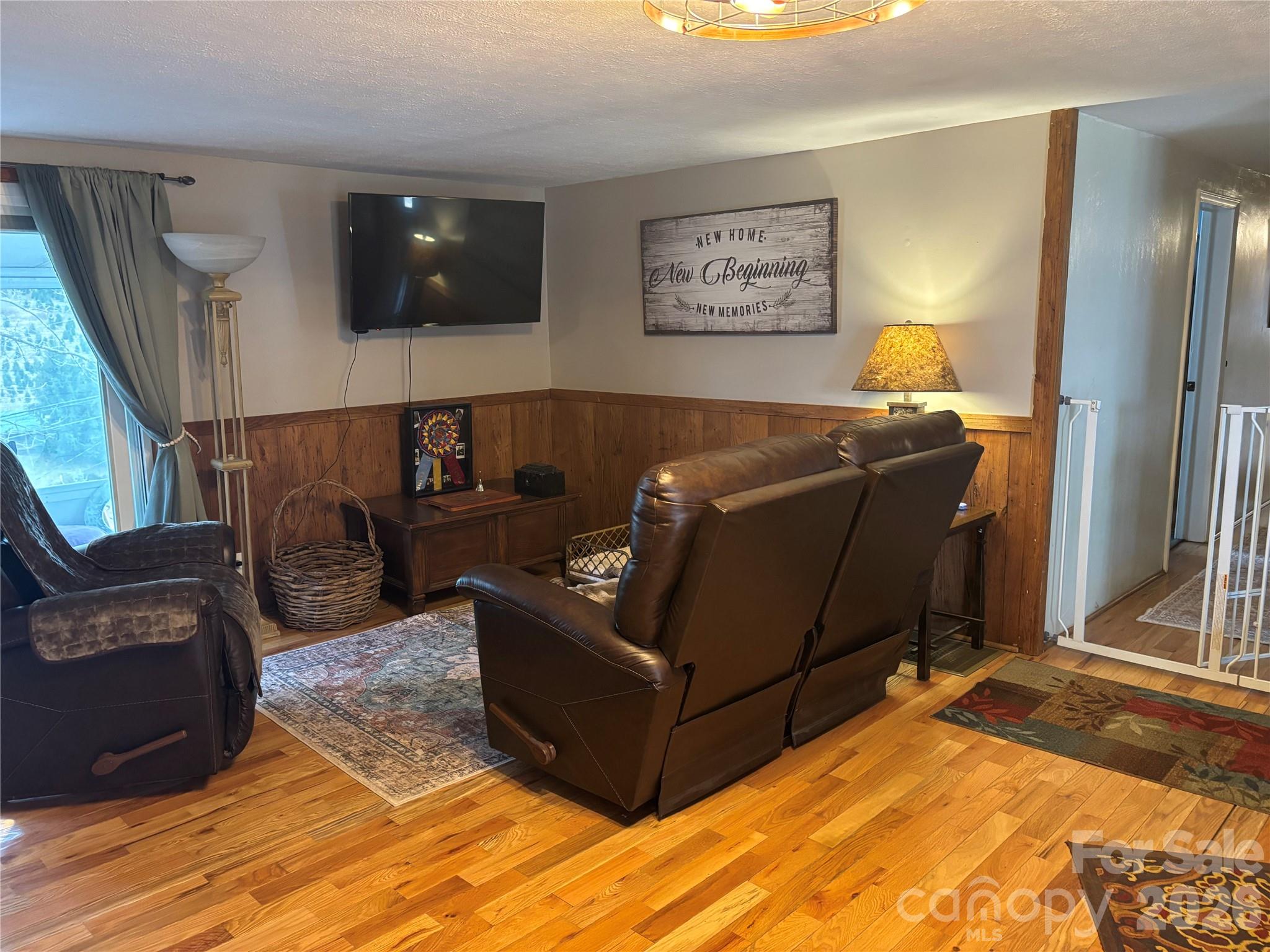 190 Benfield Road Crossnore, NC 28657 - Photo 18 of 36 a living room with furniture and a flat screen tv