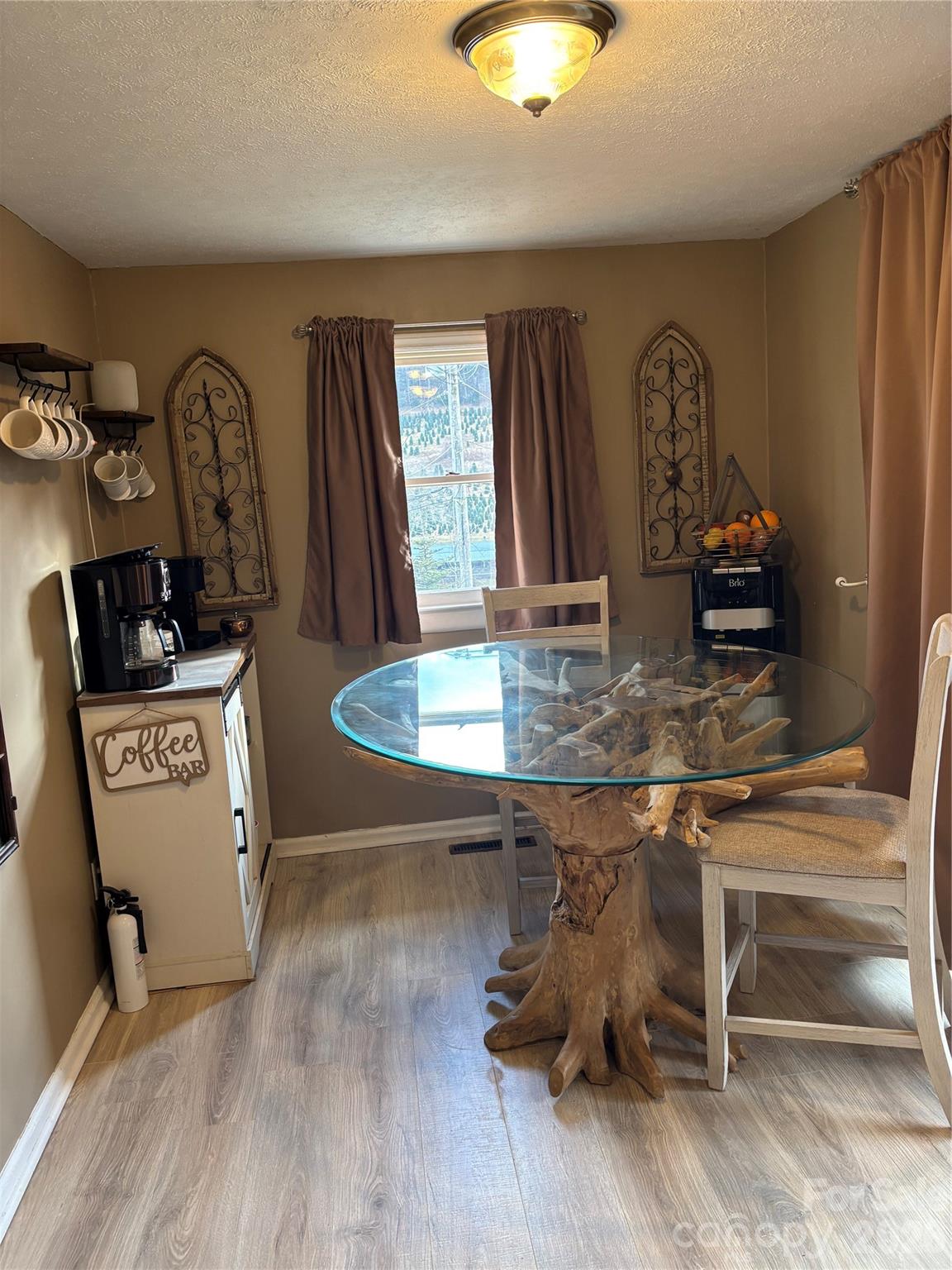 190 Benfield Road Crossnore, NC 28657 - Photo 21 of 36 a dining room with kitchen island stainless steel appliances furniture stove and kitchen view