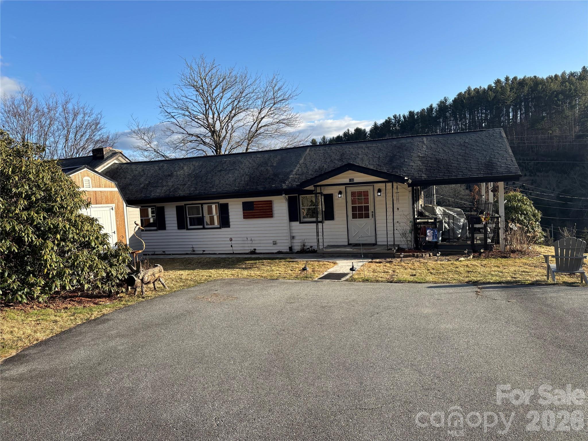 190 Benfield Road Crossnore, NC 28657 - Photo 26 of 36 a view of a house with pool and a yard