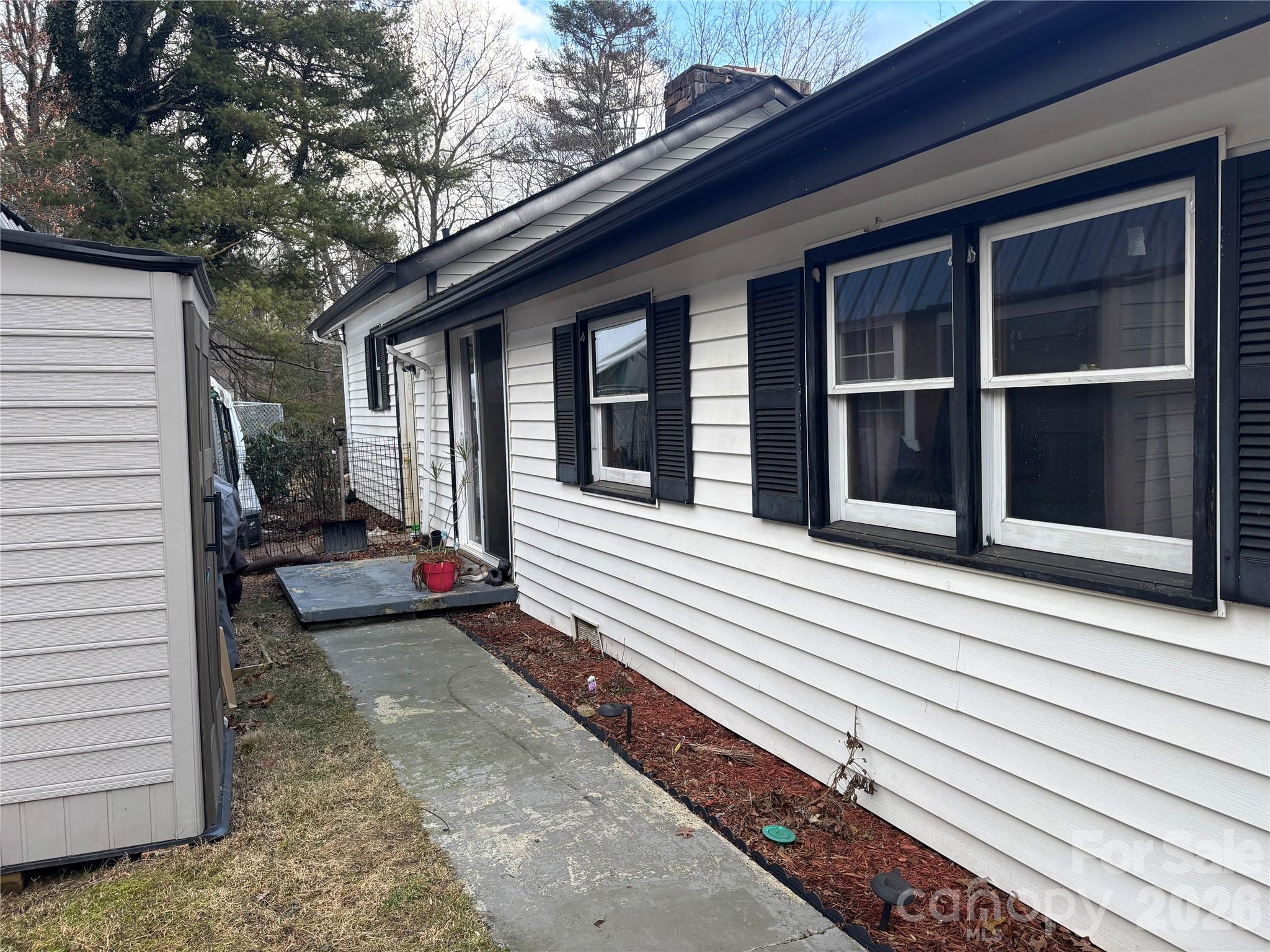 190 Benfield Road Crossnore, NC 28657 - Photo 3 of 36 a view of a house with a door and wooden floor