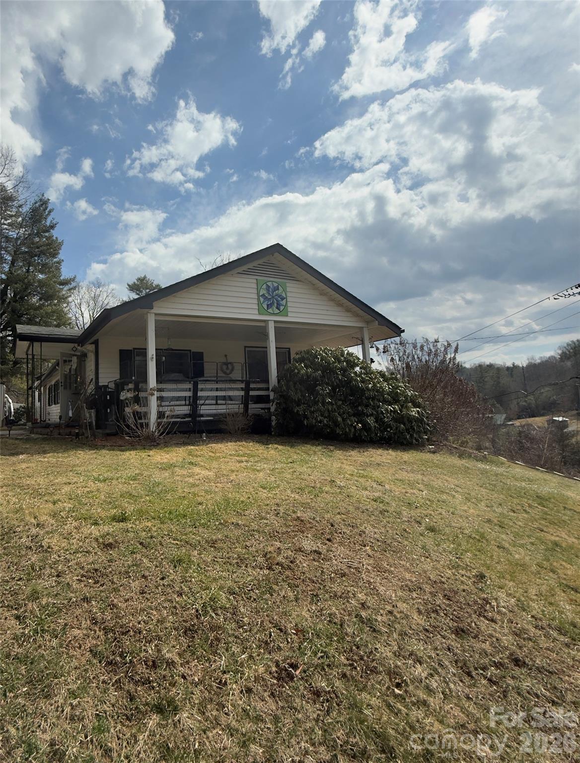 190 Benfield Road Crossnore, NC 28657 - Photo 34 of 36 a front view of a house with a garden