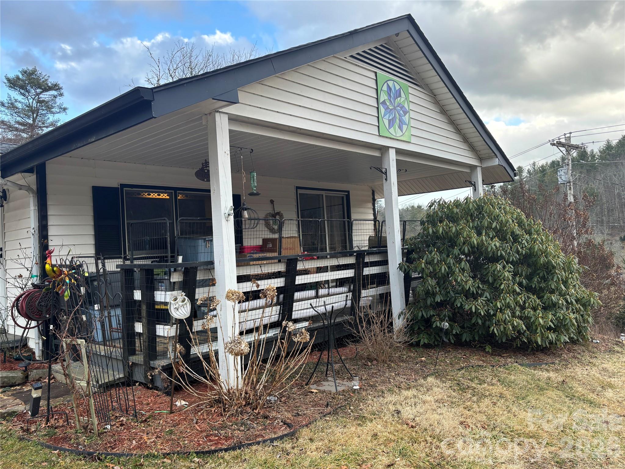 190 Benfield Road Crossnore, NC 28657 - Photo 5 of 36 a view of a house with patio