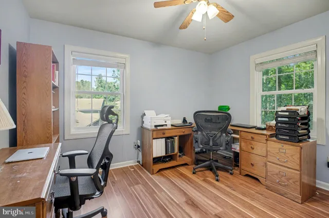 a bathroom with a sink a toilet and a window
