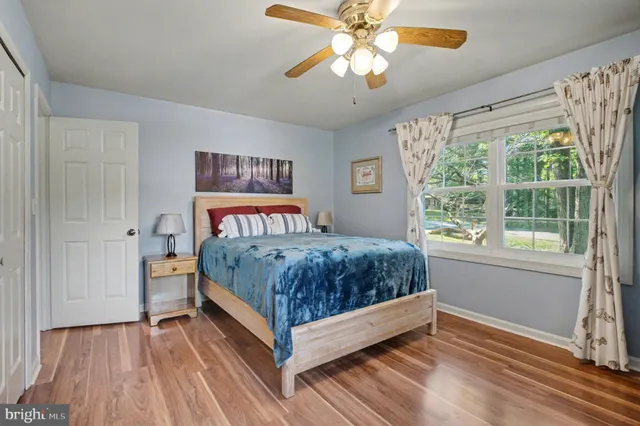 a bedroom with a bed and a chair