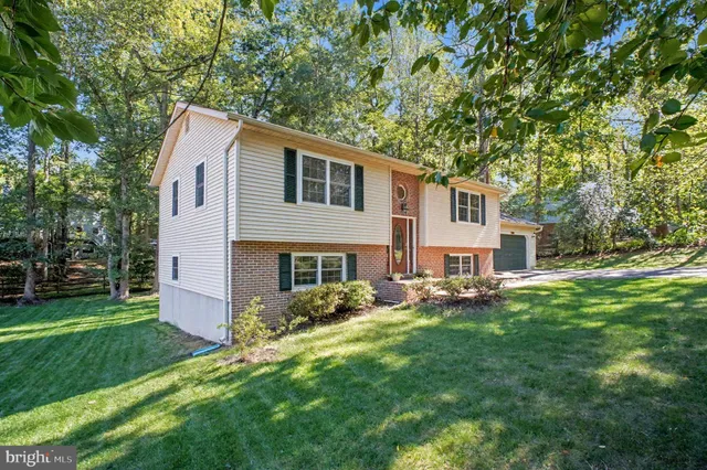 a view of house with yard