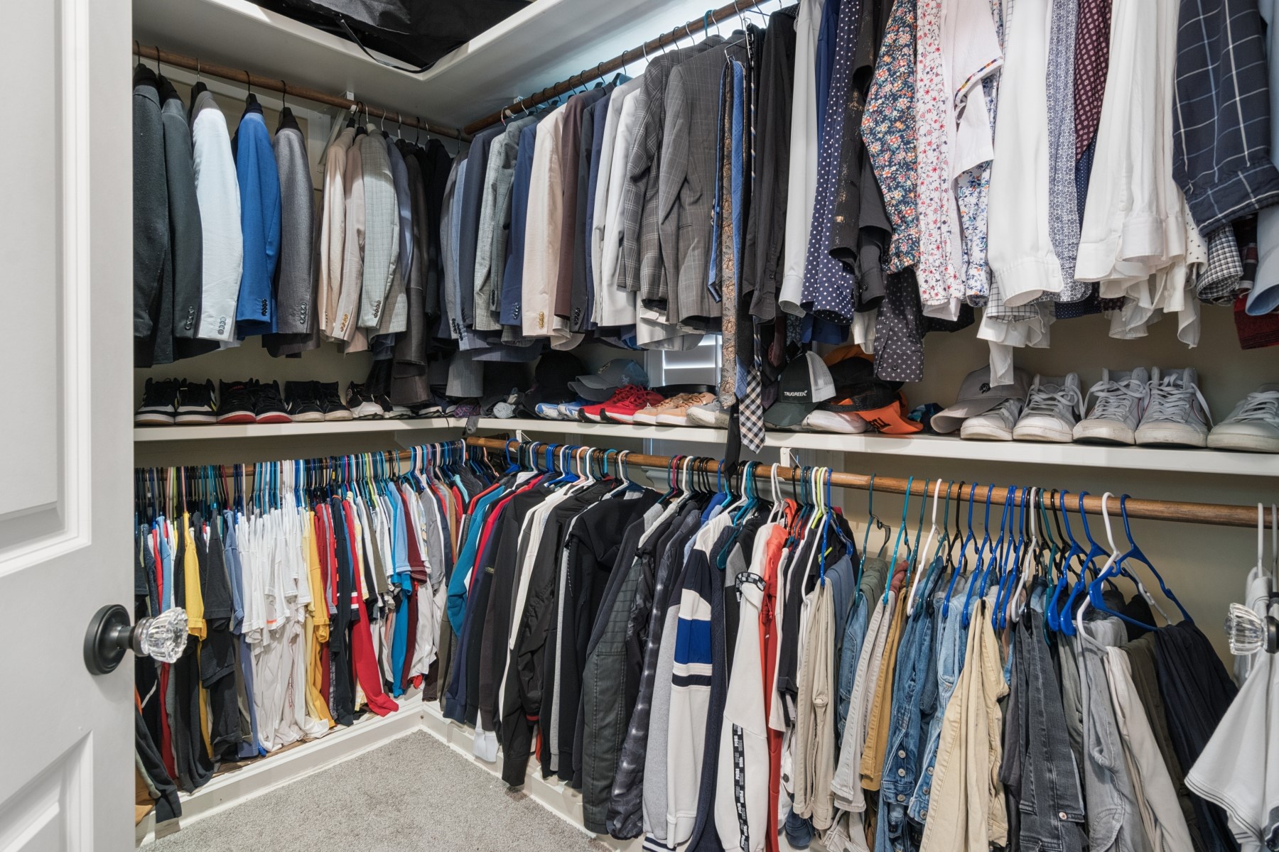 3818 Waterbend Cove Spring, TX 77386 - Photo 20 of 44 a view of walk in closet with clothes and shoes