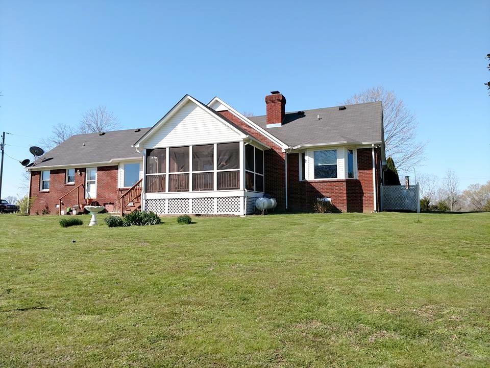 1015 Oak Grove Road Goodspring, TN 38460 - Photo 5 of 30 a front view of a house with a garden