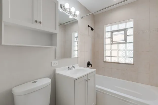 a bathroom with a sink a toilet and a bathtub