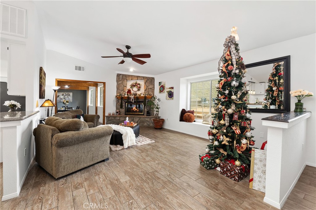 10526 Rainbrook Drive Fallbrook, CA 92028 - Photo 12 of 63 a living room with furniture or chandelier and a wooden floor
