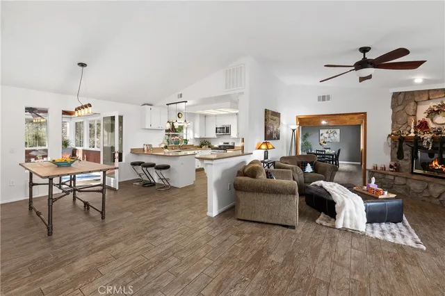 a kitchen with a sink stove and white cabinets