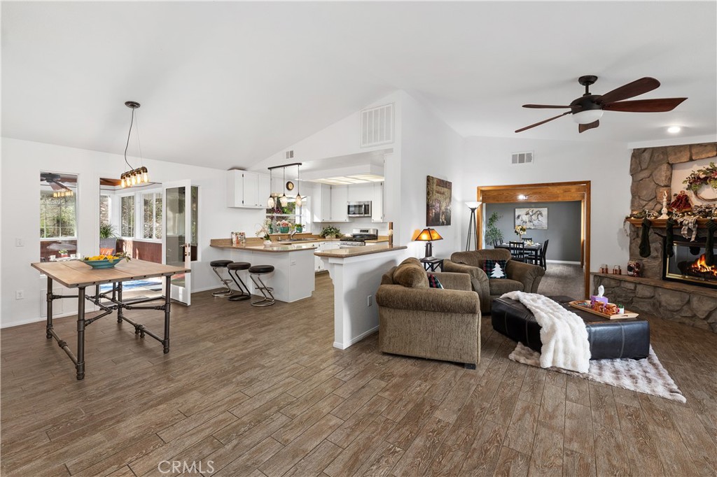 10526 Rainbrook Drive Fallbrook, CA 92028 - Photo 16 of 63 a living room with furniture kitchen view and a wooden floor