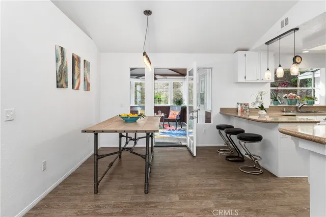 a kitchen with stainless steel appliances granite countertop a sink and a stove