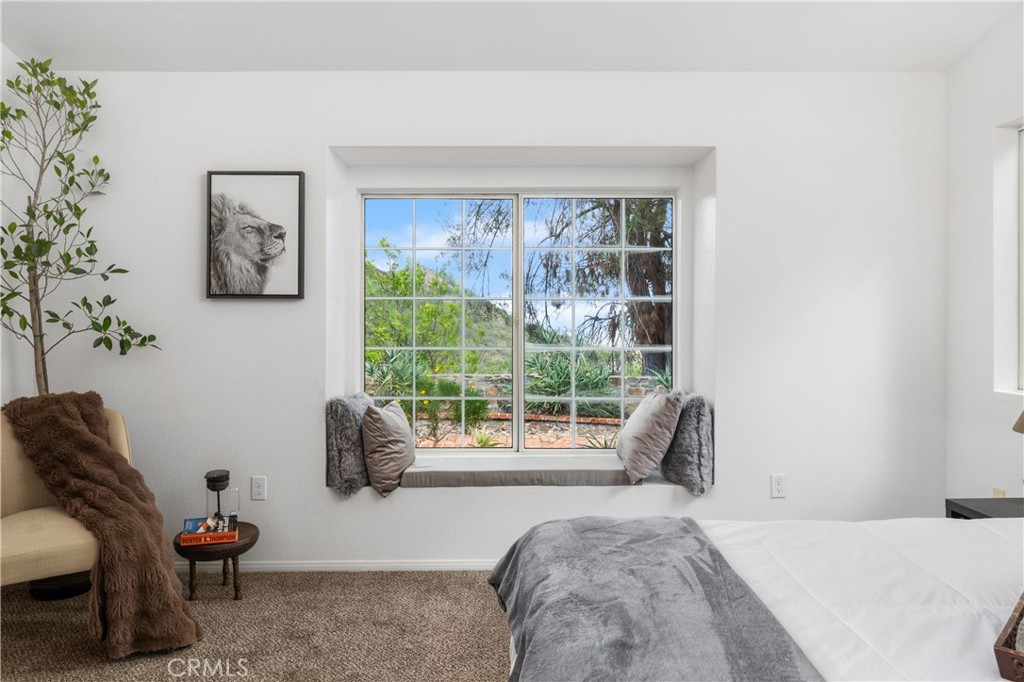 10526 Rainbrook Drive Fallbrook, CA 92028 - Photo 25 of 63 a bedroom with furniture and a large window