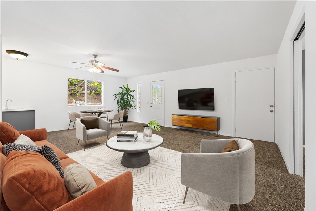 10526 Rainbrook Drive Fallbrook, CA 92028 - Photo 29 of 63 a living room with furniture and a flat screen tv
