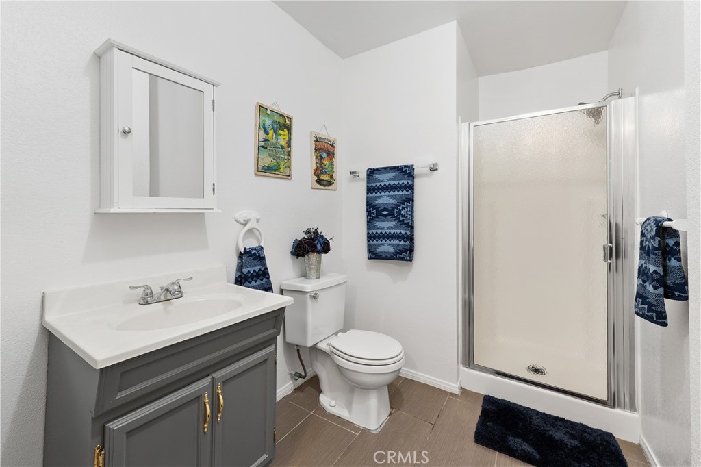 10526 Rainbrook Drive Fallbrook, CA 92028 - Photo 32 of 63 a bathroom with a sink a toilet and shower