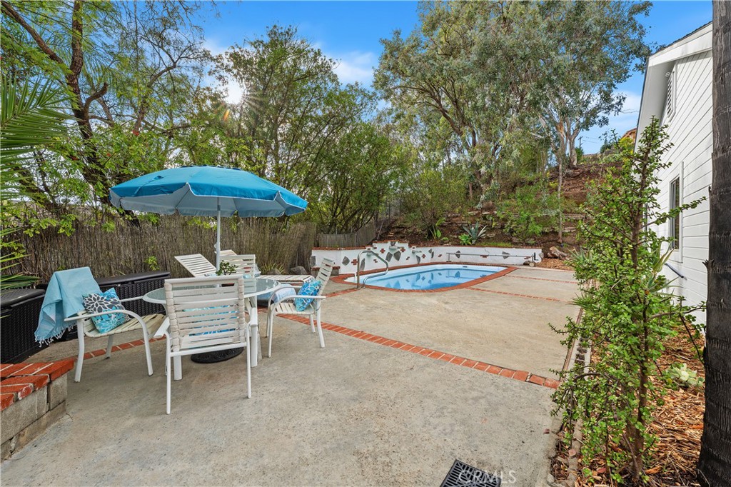 10526 Rainbrook Drive Fallbrook, CA 92028 - Photo 42 of 63 a view of a tables and chairs under an umbrella