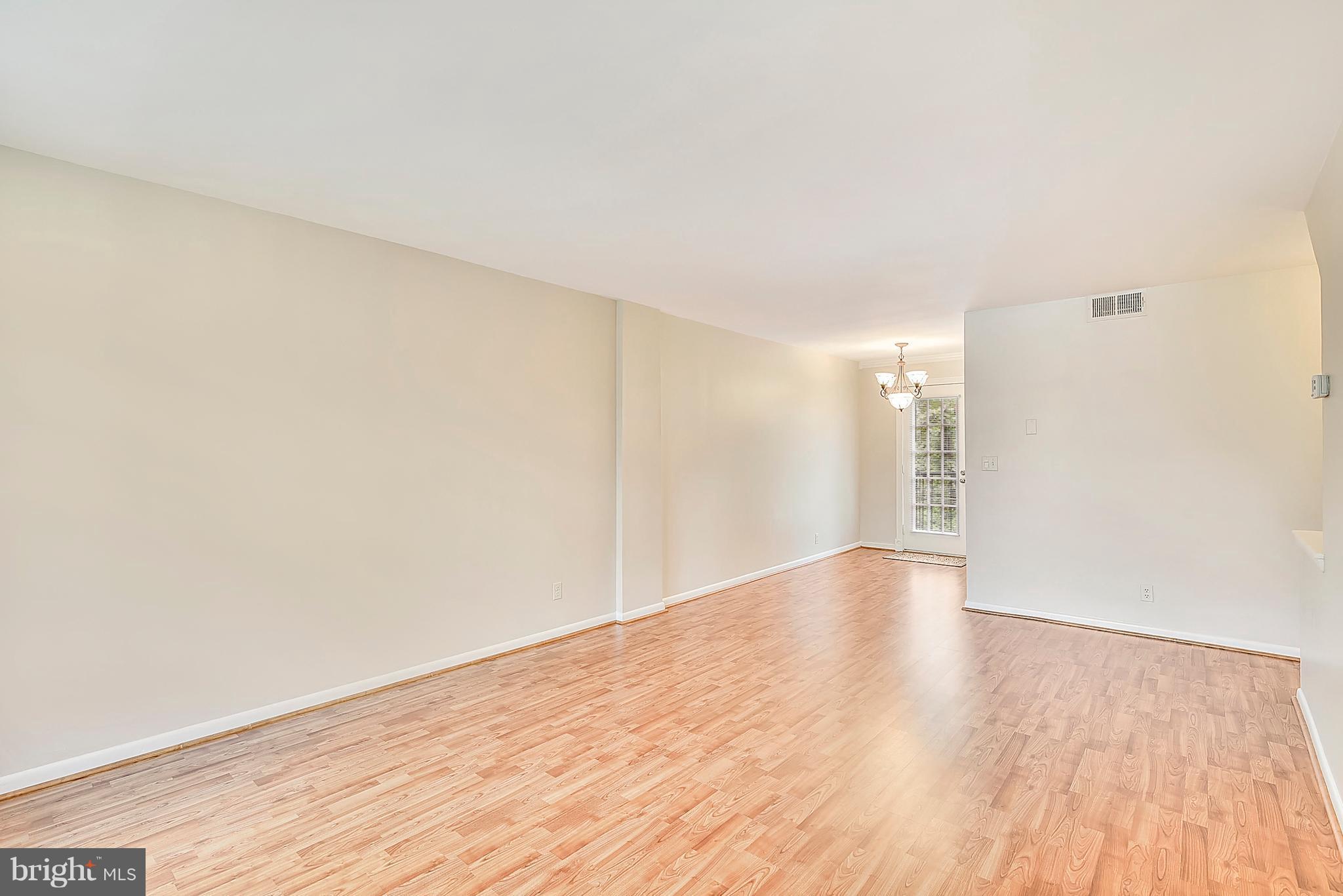 4615 28th Road South, Unit B Arlington, VA 22206 - Photo 2 of 24 a view of an empty room with wooden floor
