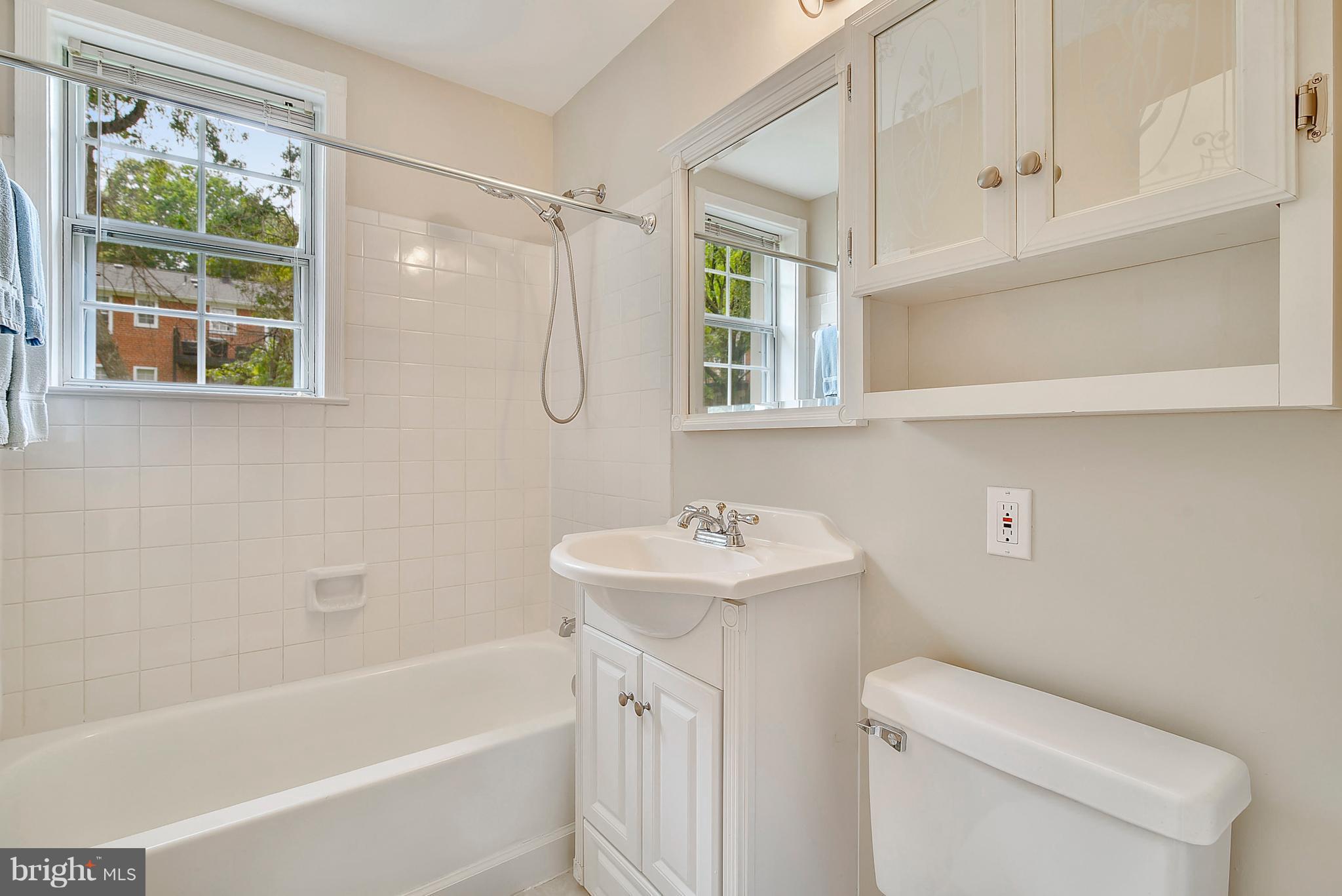 4615 28th Road South, Unit B Arlington, VA 22206 - Photo 14 of 24 a bathroom with a sink toilet and shower