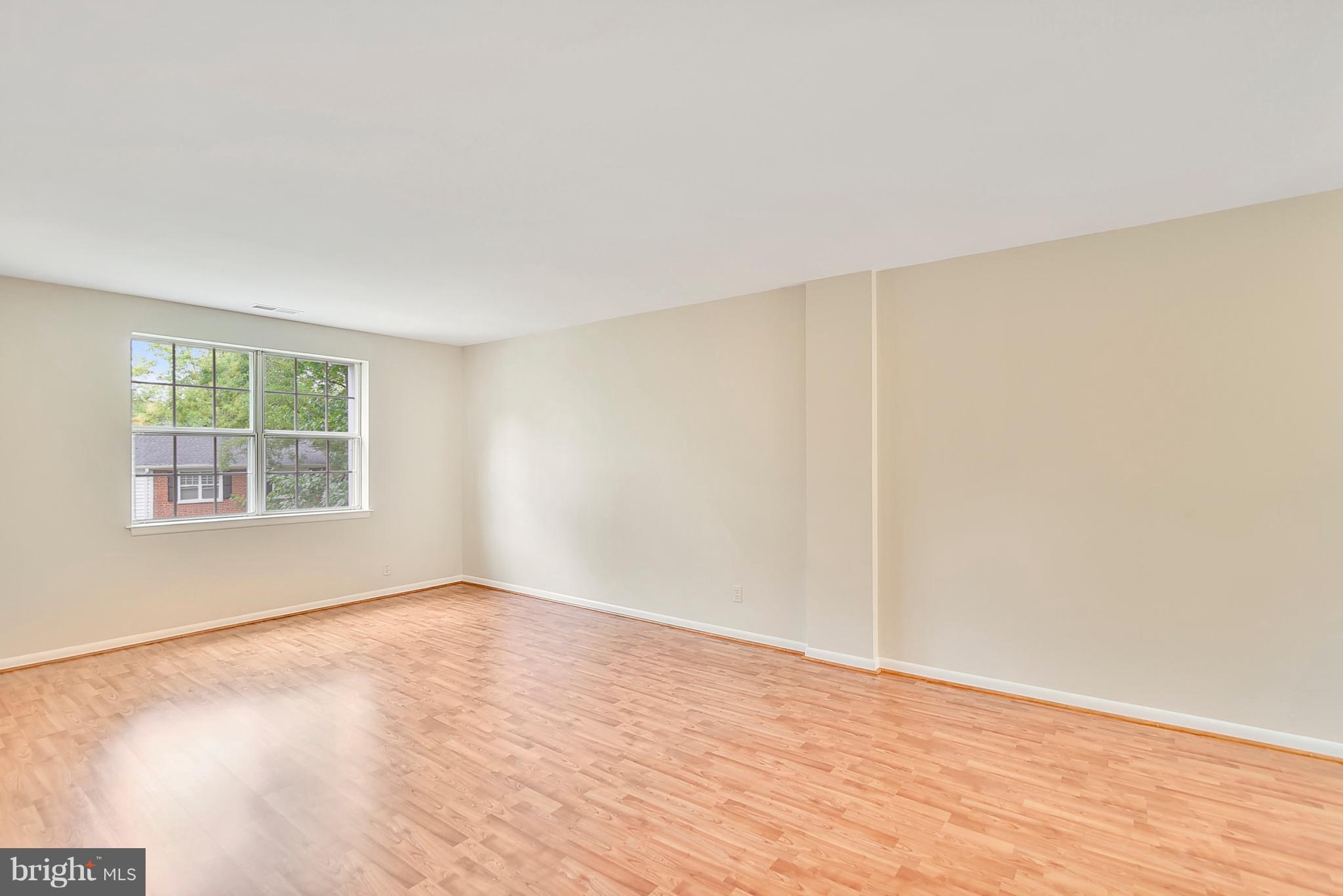 4615 28th Road South, Unit B Arlington, VA 22206 - Photo 4 of 24 an empty room with wooden floor and windows