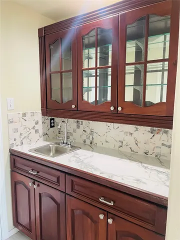 a white refrigerator freezer and a table in it