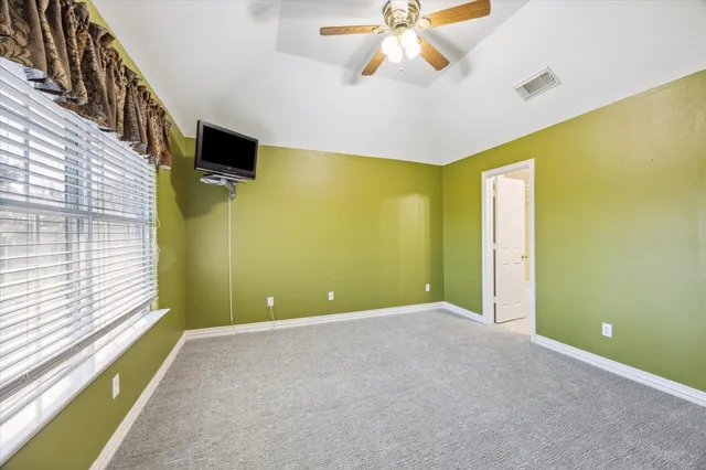 a view of a porch with furniture and a yard