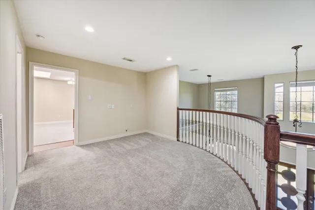 a view of a swimming pool with a chairs