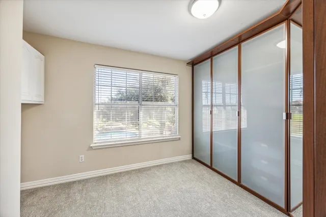 swimming pool view with a garden and outdoor seating