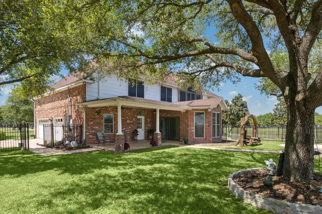 a black and white building with trees in the background