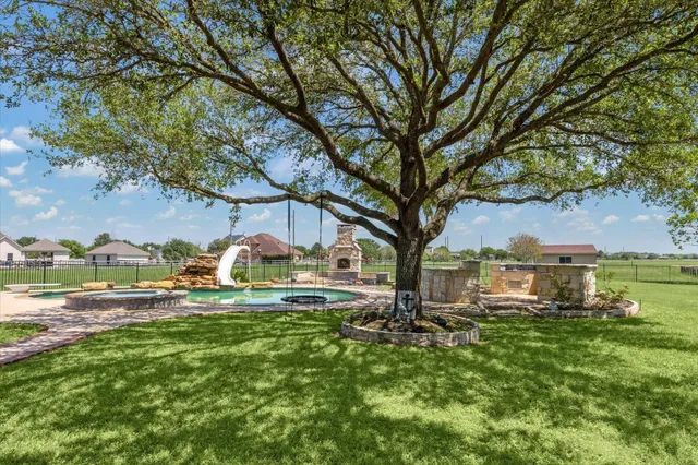 an aerial view of a house with outdoor space swimming pool and mountains